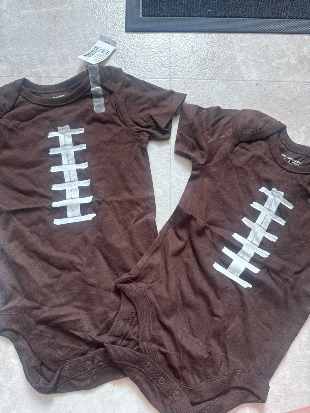 The Children's Place Brown Bodysuit with White Football Stitch Graphic